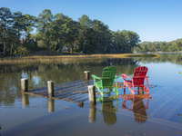 Chairs on Dock, from the series Tidewater, 2020.  Greta Pratt