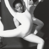 Dancers in White Bodysuits