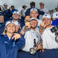 Fans celebrating in victory.png